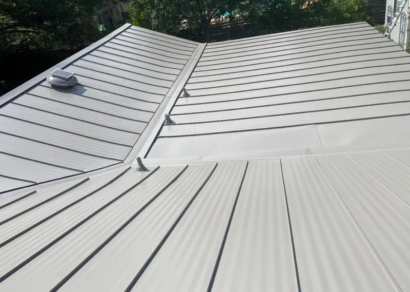 Solar attic fan installed on a metal roof for Roof Ventilation in Jefferson Hills